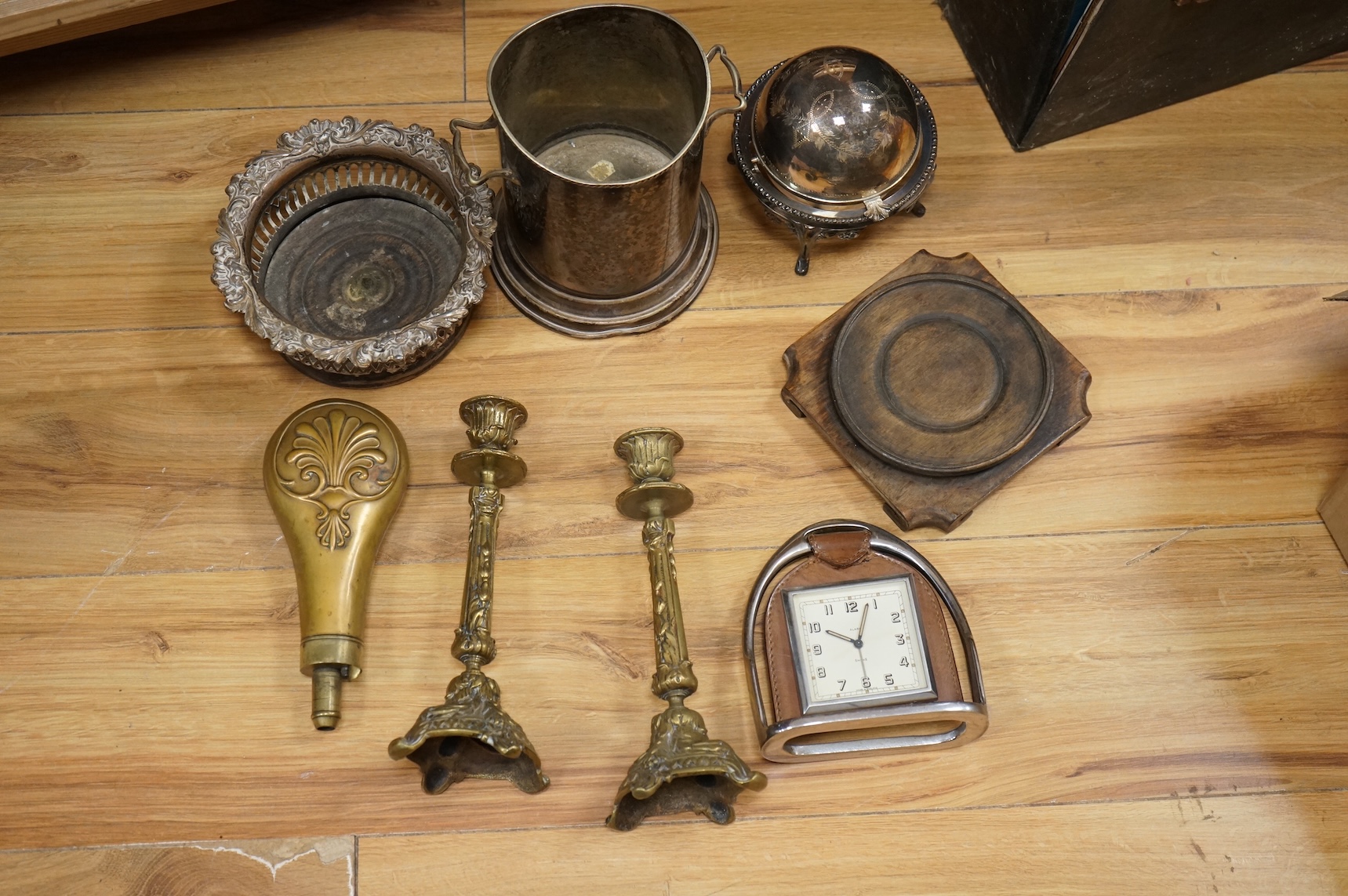 A group of assorted plated items including entree dishes, flatware and wine coaster.